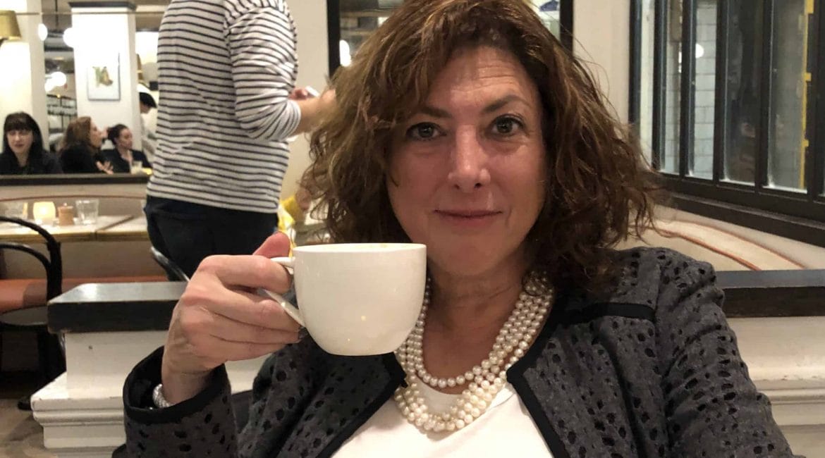 Hilary Topper drinking coffee