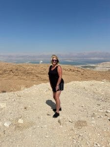 mindy standing on a rock in front of Dead Sea